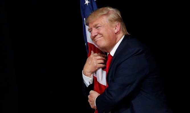 Trump cheek to cheek with flag